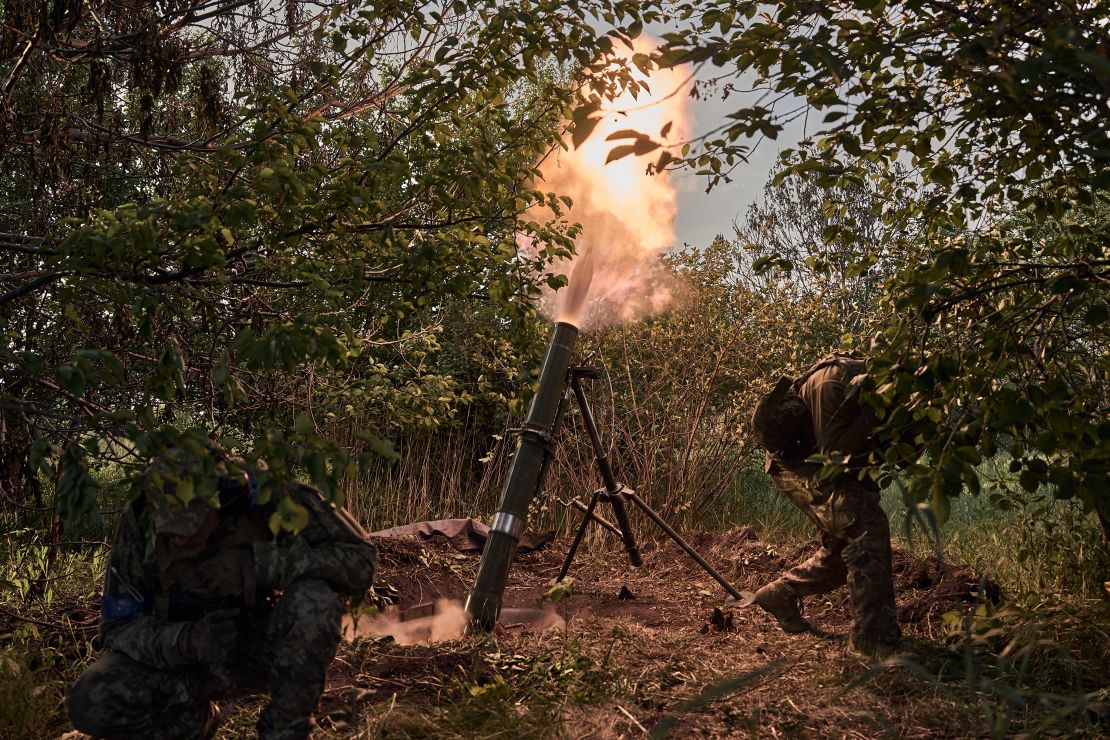Ukrainian soldiers of the assault brigade defend the front line, which passes through the Ukrainian border city of Vovchansk, in Chuhuiv Raion, Kharkiv Oblast, on May 20, 2024.