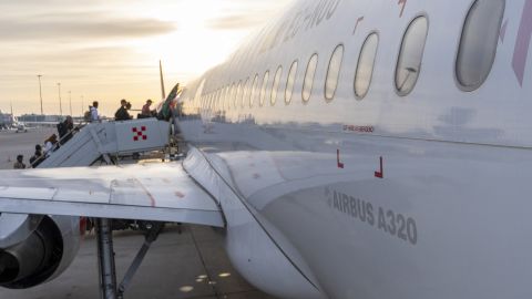 Sunrise and silhouette of engers boarding an Airbus A320 belonging to Spanish low-cost airline Volotea on the tarmac at Palermo airport in Sicily, Italy on 14 May 2024. (Photo by Antoine Boureau / Hans Lucas / Hans Lucas via AFP) (Photo by ANTOINE BOUREAU/Hans Lucas/AFP via Getty Images)