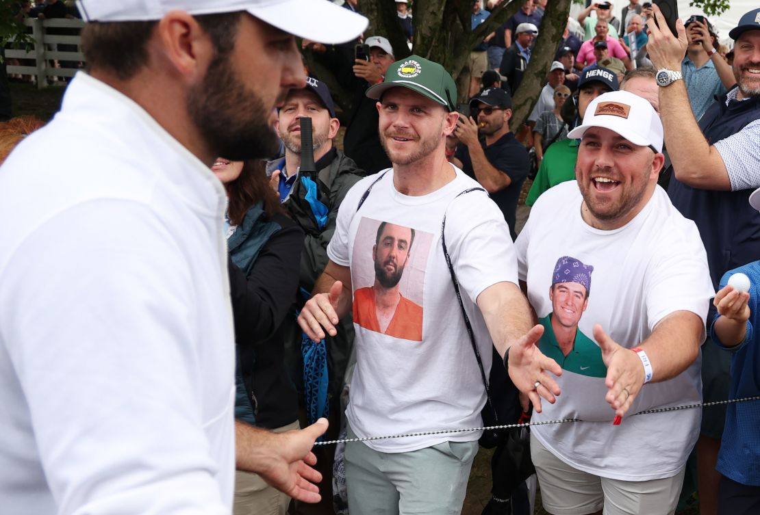 Scheffler walks past fans during the second round.