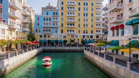 Qanat Quartier,Doha, Qatar- February 20,2024: residential and shops in vibrant colors at pearl residential area with venice concept.