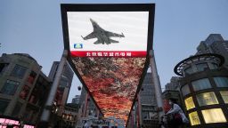 A large screen in Beijing shows on May 23, 2024, news that China's military began a two-day drill around Taiwan. The exercises, involving China's army, navy, air and rocket forces, followed the May 20 inauguration of Taiwan President Lai Ching-te.