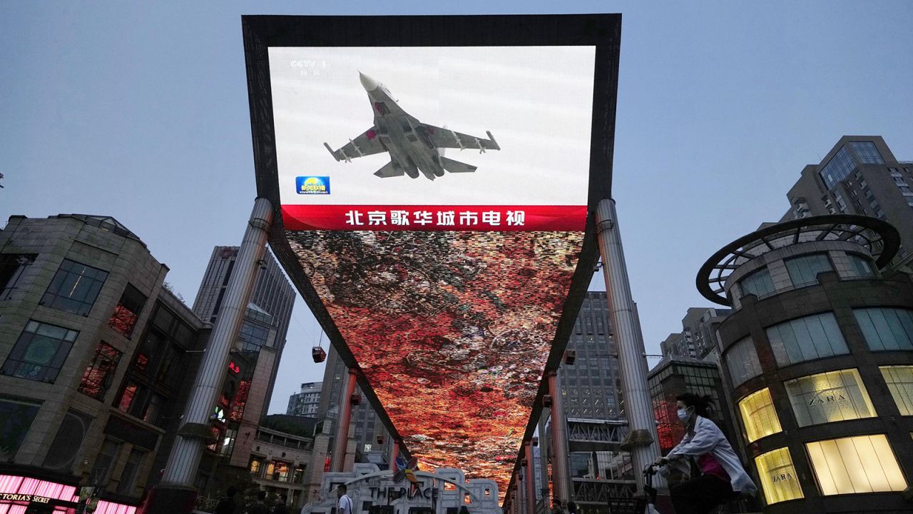 A large screen in Beijing shows on May 23, 2024, news that China's military began a two-day drill around Taiwan. The exercises, involving China's army, navy, air and rocket forces, followed the May 20 inauguration of Taiwan President Lai Ching-te.