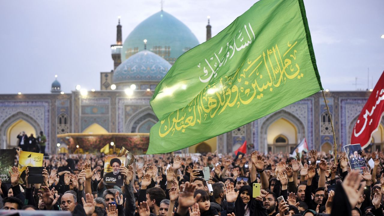 Iranians mourn late president Ebrahim Raisi at the Imam Reza shrine during the funeral ceremony in the city of Mashhad on May 23, 2024. Raisi and seven of his entourage, including foreign minister Hossein Amir-Abdollahian, were killed in a helicopter crash on a fog-shrouded mountainside in Iran on May 19. (Photo by Hossein MOAMERI / FARS NEWS AGENCY / AFP) (Photo by HOSSEIN MOAMERI/FARS NEWS AGENCY/AFP via Getty Images)