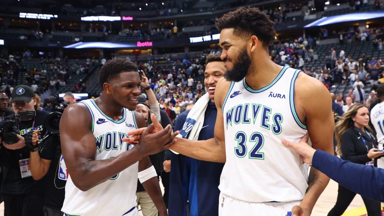 DENVER, COLORADO - MAY 19: Anthony Edwards #5 and Karl-Anthony Towns #32 of the Minnesota Timberwolves celebrate after winning Game Seven of the Western Conference Second Round Playoffs against the Denver Nuggets at Ball Arena on May 19, 2024 in Denver, Colorado. NOTE TO USER: User expressly acknowledges and agrees that, by downloading and or using this photograph, User is consenting to the terms and conditions of the Getty Images License Agreement. (Photo by C. Morgan Engel/Getty Images)