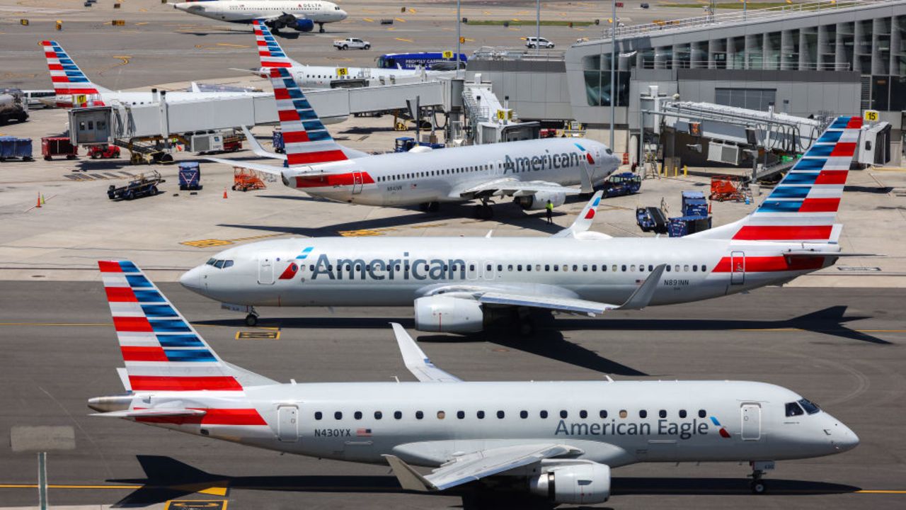 An American Airlines' Embraer E175LR (front), an American Airlines' Boeing 737 (C) and an American Airlines' Boeing 737 are seen parked at LaGuardia Airport in Queens, New York on May 24, 2024. (Photo by Charly TRIBALLEAU / AFP) (Photo by CHARLY TRIBALLEAU/AFP via Getty Images)