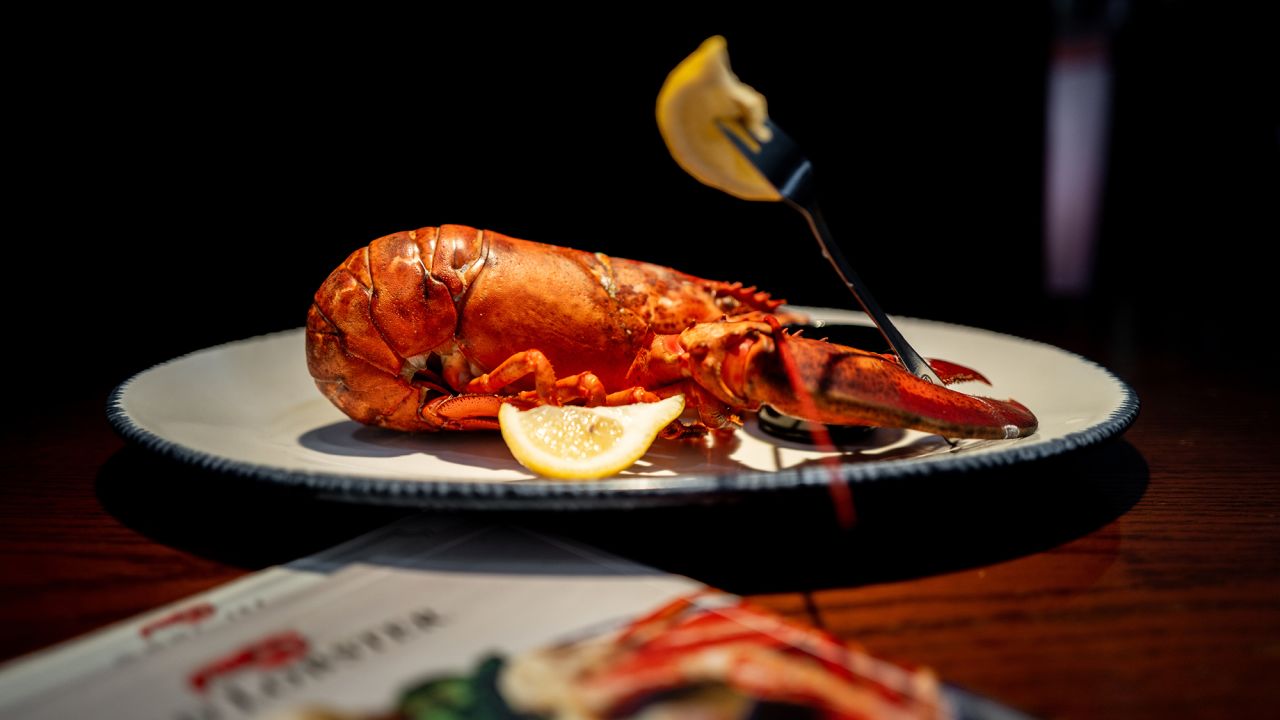 In this photo illustration, a cooked lobster is displayed on a plate at a Red Lobster restaurant on May 20, 2024 in Austin, Texas. Red Lobster has filed for Chapter 11 bankruptcy protection after a failed lease-back agreement and "endless shrimp" promotion backfired against company revenue.