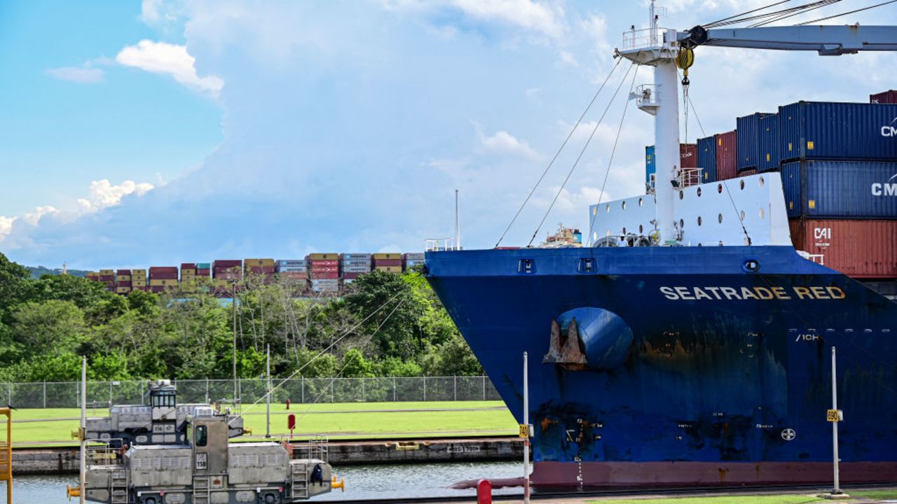 Locomotives help guide a cargo ship as it passes through the Miraflores locks while transiting the Panama Canal near Panama City on May 24, 2024. (Photo by MARTIN BERNETTI / AFP) (Photo by MARTIN BERNETTI/AFP via Getty Images)