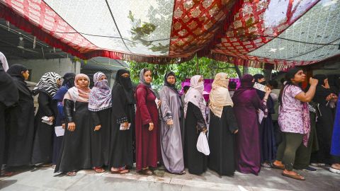 NEW DELHI, INDIA - MAY 25: Women Voters seen waiting their turn under a makeshift canopy on a hot day at a polling station during the Sixth phase of voting for General Lok Sabha elections , at Ashraf Ali Road school on May 25, 2024 in New Delhi, India. Polling for the sixth phase of general elections concluded in 58 constituencies across six states and two Union territories, including all seven seats in Delhi. Voter turnout across six states and two Union Territories during Phase 6 polling has been recorded at approximately 58.84 per cent, according to the Voter Turnout App of the Election Commission. (Photo by Raj K Raj/Hindustan Times via Getty Images)