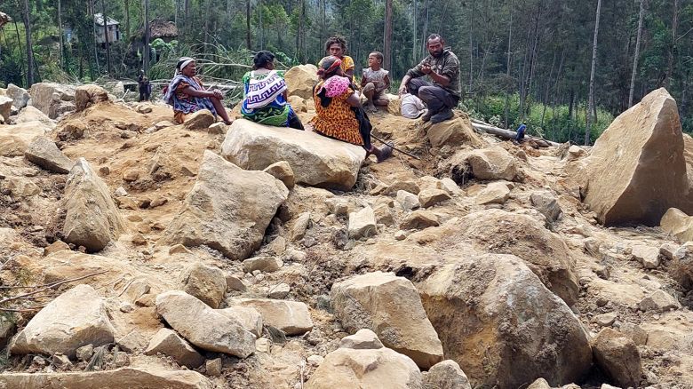 Family members of missing villagers are seen at the site of a landslide at Mulitaka village in the region of Maip Mulitaka, in Papua New Guinea's Enga Province on May 26, 2024.
