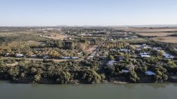 An aerial view shows agricultural land to the right, the Orange River and Orania, an "Afrikaner-only" town in South Africa's Northern Cape, on May 26, 2024.