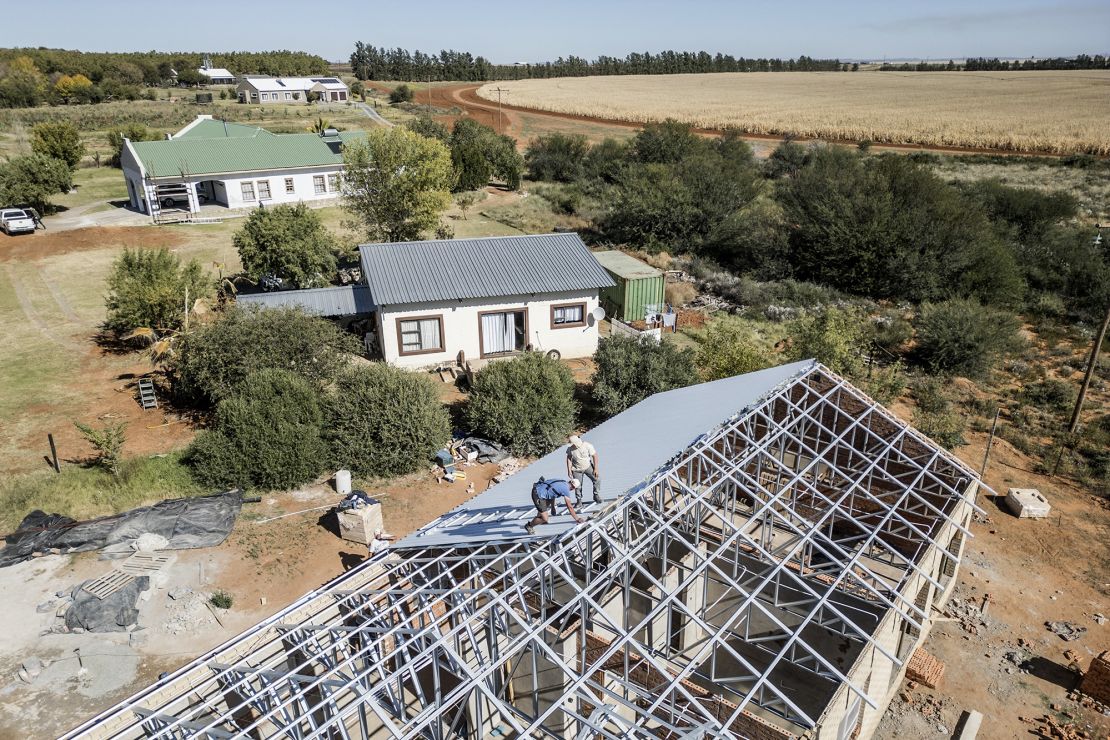An aerial view of workers assembling the roof of a house in Orania, on May 27, 2024.