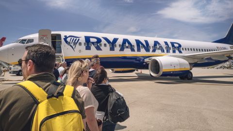 People board a Ryanair plane heading to Carcassonne in France at Porto airport, Portugal in May 2024.