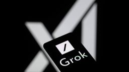 The Grok logo is being displayed on a smartphone with the X AI icon visible in the background in this photo illustration in Brussels, Belgium, on May 27, 2024. (Photo by Jonathan Raa/NurPhoto via Getty Images)