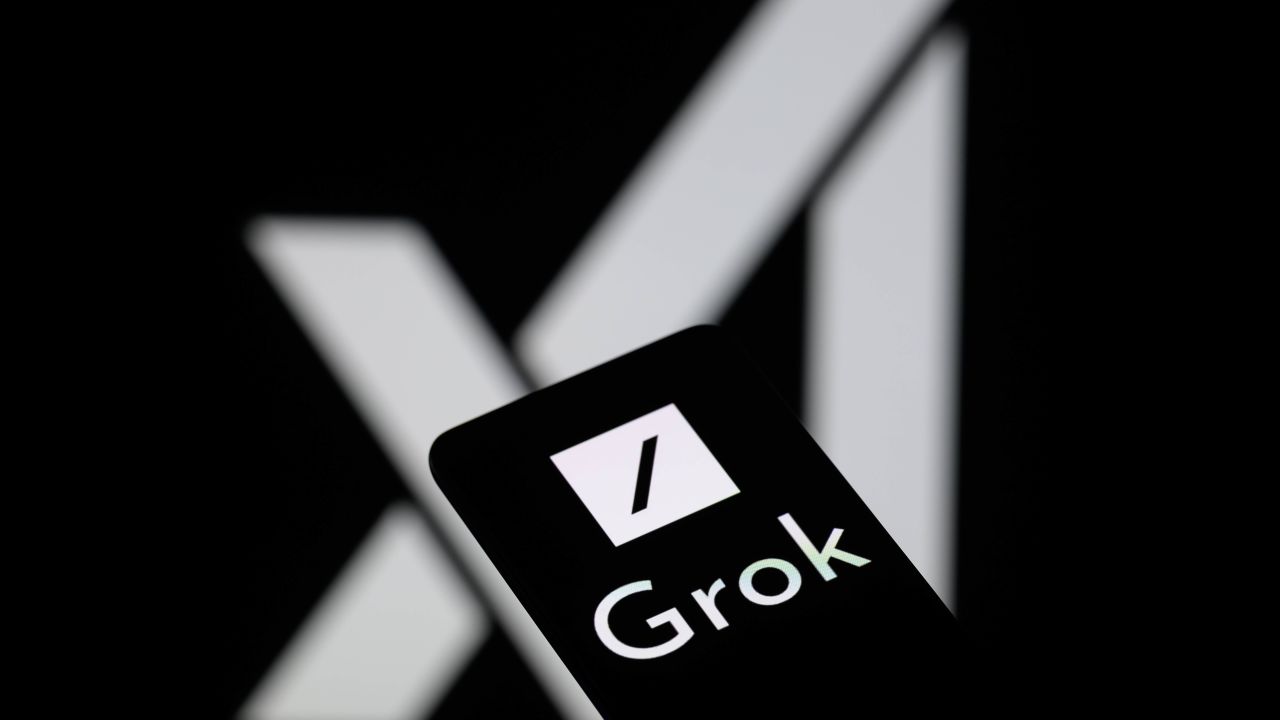 The Grok logo is being displayed on a smartphone with the X AI icon visible in the background in this photo illustration in Brussels, Belgium, on May 27, 2024. (Photo by Jonathan Raa/NurPhoto via Getty Images)