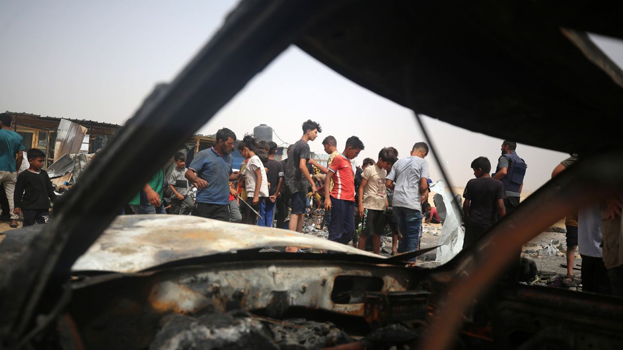 Palestinians are gathering at the site of an Israeli strike on a camp for internally displaced people in Rafah, on May 27, 2024, amid ongoing battles between Israel and the Palestinian Hamas militant group.