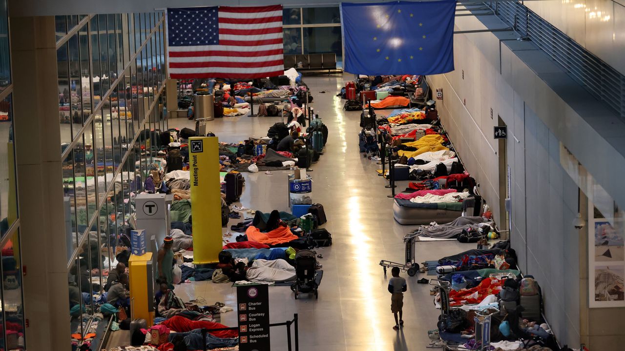 Boston, MA - May 22: An overflow of homeless migrants encamped at Logan Airport, International Terminal E. (Photo by David L. Ryan/The Boston Globe via Getty Images)