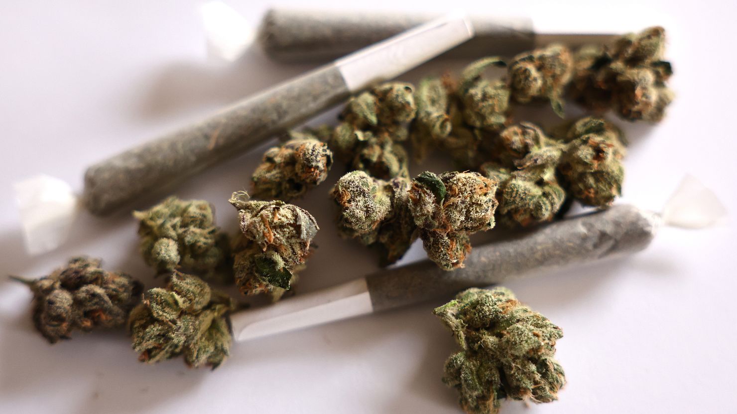 LOS ANGELES, CALIFORNIA - MAY 24: In this photo illustration, marijuana joints and buds, also known as 'flower', are viewed on May 24, 2024 in Los Angeles, California. A new study by Carnegie Mellon University has found that marijuana consumption has overtaken alcohol as more Americans now use marijuana on a daily or near-daily basis than those who drink alcohol at a similar frequency. (Photo Illustration by Mario Tama/Getty Images)