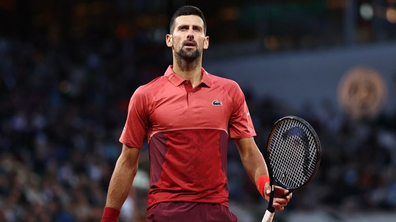 Serbia's Novak Djokovic looks on as he plays against France's Pierre-Hugues Herbert during their men's singles match on Court Philippe-Chatrier on day three of the French Open tennis tournament at the Roland Garros Complex in Paris on May 28, 2024. (Photo by Anne-Christine POUJOULAT / AFP) (Photo by ANNE-CHRISTINE POUJOULAT/AFP via Getty Images)