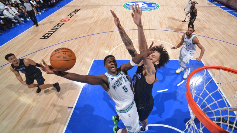 MINNEAPOLIS, MN -  MAY 24: Anthony Edwards #5 of the Minnesota Timberwolves drives to the basket during the game against the Dallas Mavericks during Game 2 of the Western Conference Finals of the 2024 NBA Playoffs on February 24, 2024 at Target Center in Minneapolis, Minnesota. NOTE TO USER: User expressly acknowledges and agrees that, by downloading and or using this Photograph, user is consenting to the terms and conditions of the Getty Images License Agreement. Mandatory Copyright Notice: Copyright 2024 NBAE (Photo by Jesse D. Garrabrant/NBAE via Getty Images)