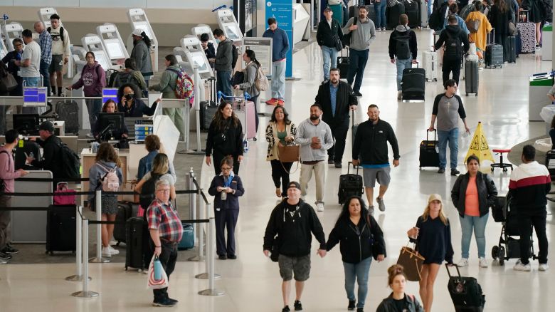 Passengers check in at San Francisco International Airport on May 24, 2024 in San Francisco, California. An estimated 43.8 million Americans will travel over Memorial Day weekend, a 4% increase from last year.