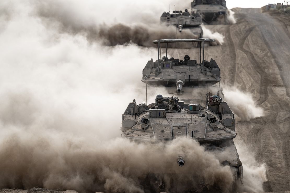 Israeli armored vehicles drive along Gaza's northern border on May 29.