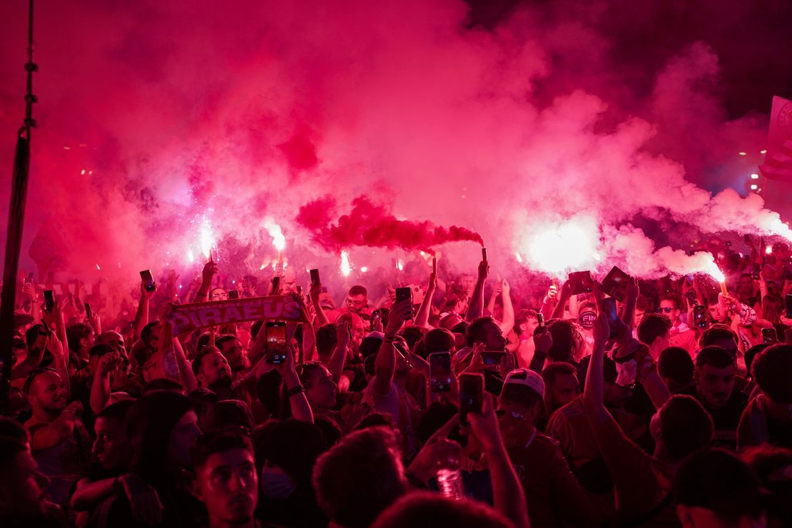 Olympiacos fans celebrate the teams win in Piraeus.