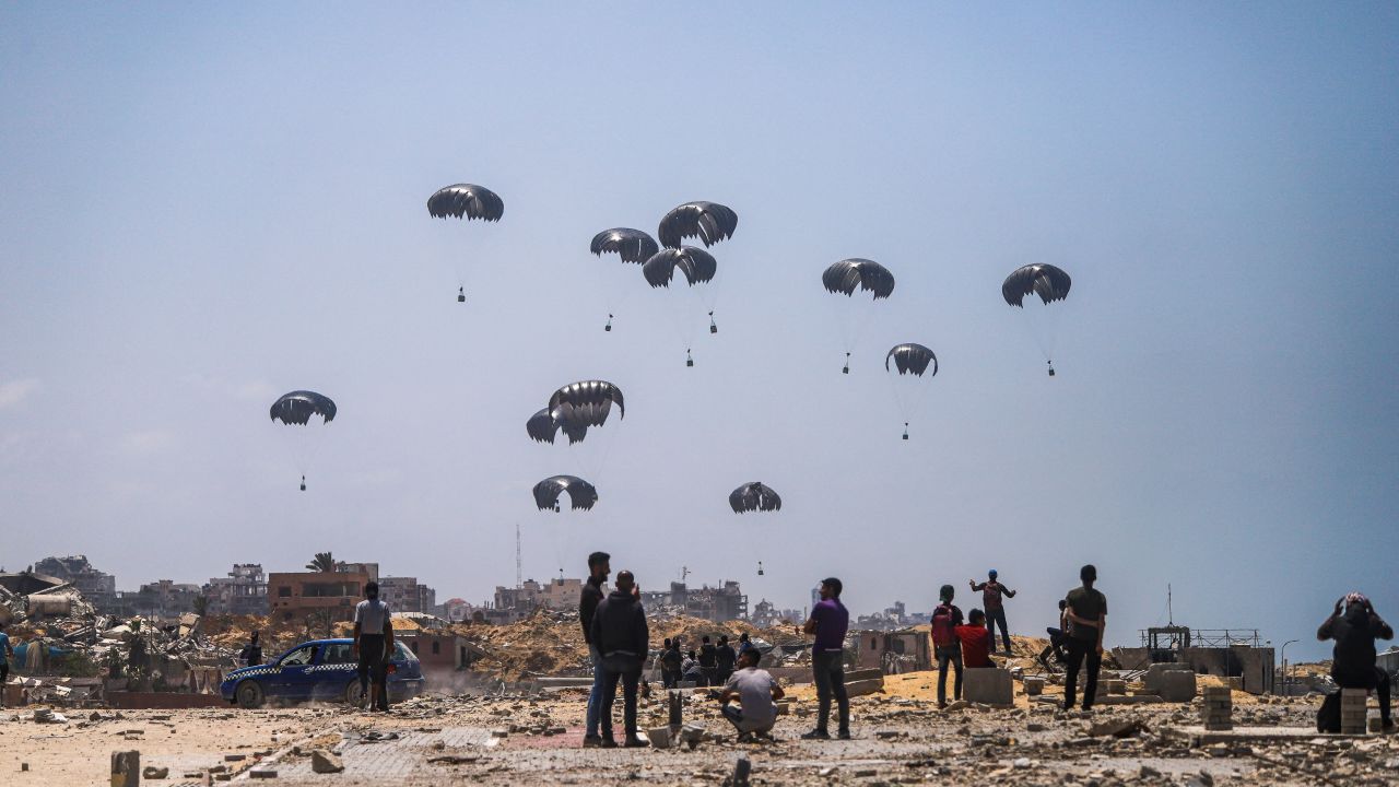 Packages of aid lands on parts of Gaza dropped from the air by planes in an attempt to ease the pressure on the dire humanitarian situation caused by Israel's war on the strip on April 30, 2024. According to the United Nations and humanitarian agencies, nearly 1.7 million Palestinians have been displaced from their homes. Despite the growing pressure on the Israeli government led by Benjamin Netanyahu to accept the proposed truce and start a ceasefire, the Israeli war cabinet has insisted on going ahead with a wider military operation in the Gaza Strip. (Photo by Abood Abusalama / Middle East Images / Middle East Images via AFP) (Photo by ABOOD ABUSALAMA/Middle East Images/AFP via Getty Images)