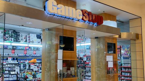 MIAMI, FLORIDA - MAY 28: A GameStop sign hangs near the entrance on May 28, 2024 in Miami, Florida. GameStop stock jumped higher after the video game retailer announced that it had raised $933 million by selling 45 million common shares of its stock earlier this month. (Photo by Joe Raedle/Getty Images)