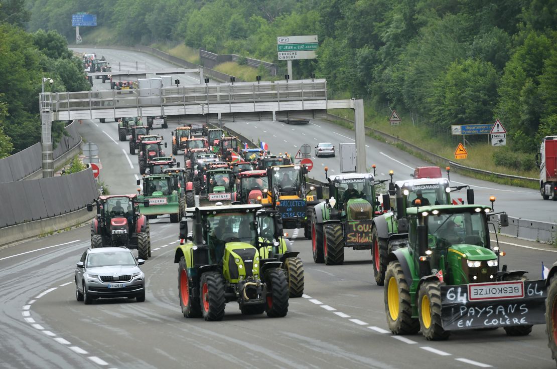 French farmers tractors arrive to block a highway on the border between Spain and France during a protest in Biriatou, southwestern France, on June 03, 2024.