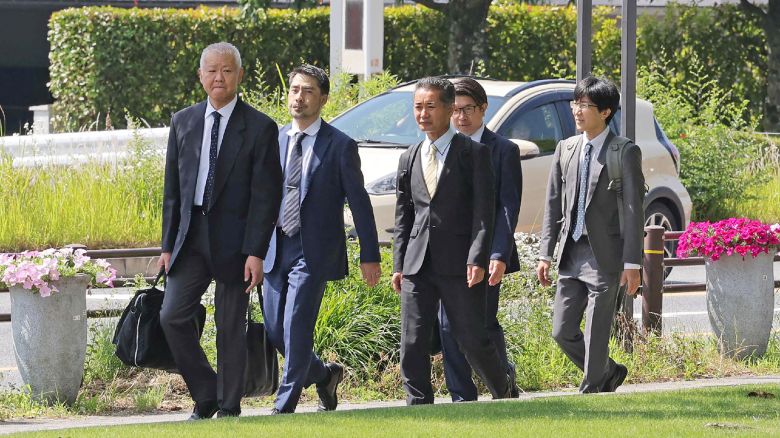 Officials from Japan's Transport Ministry enter Toyota headquarters on June 4, 2024