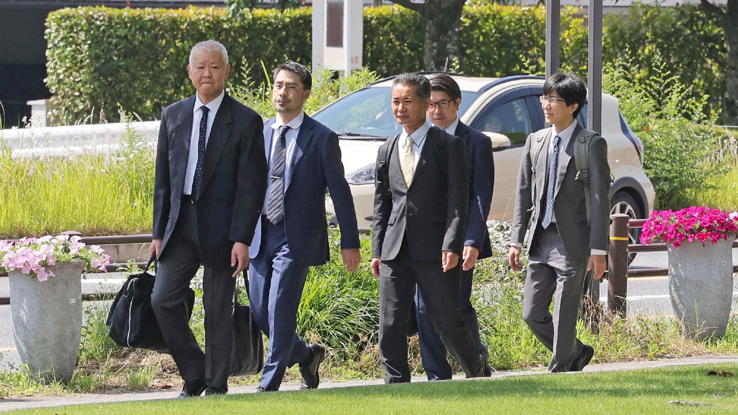 Japanese Transport Ministry officials enter Toyota's headquarters for an inspection on June 4, 2024.