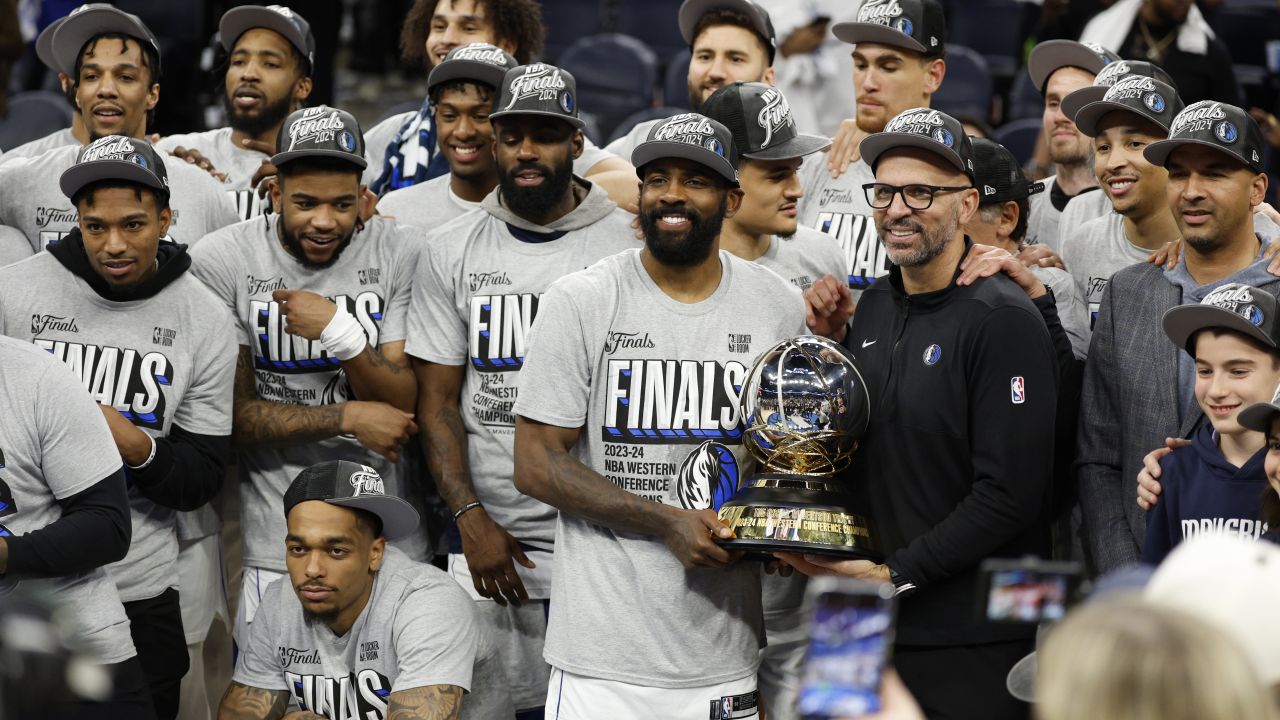 MINNEAPOLIS, MINNESOTA - MAY 30: The Dallas Mavericks celebrate with the Oscar Robertson Trophy after a 124-103 victory against the Minnesota Timberwolves in Game Five of the Western Conference Finals at Target Center on May 30, 2024 in Minneapolis, Minnesota. NOTE TO USER: User expressly acknowledges and agrees that, by downloading and or using this photograph, User is consenting to the terms and conditions of the Getty Images License Agreement. (Photo by David Berding/Getty Images)