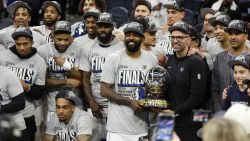 MINNEAPOLIS, MINNESOTA - MAY 30: The Dallas Mavericks celebrate with the Oscar Robertson Trophy after a 124-103 victory against the Minnesota Timberwolves in Game Five of the Western Conference Finals at Target Center on May 30, 2024 in Minneapolis, Minnesota. NOTE TO USER: User expressly acknowledges and agrees that, by downloading and or using this photograph, User is consenting to the terms and conditions of the Getty Images License Agreement. (Photo by David Berding/Getty Images)