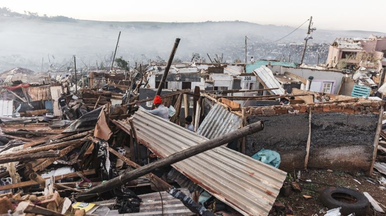 Residents salvage their belongings from destroyed houses in the aftermath of a tornado and extreme weather at an informal settlement in Tongaat, north of Durban on June 04, 2024. Twelve people have died in flooding caused by torrential rain on South Africa's eastern coast, local authorities said on Monday. In Eastern Cape province, "the death toll is currently sitting at seven," a spokesperson from Nelson Mandela Bay municipality, at the heart of the floods, told AFP. More than 2,000 people have been evacuated from Nelson Mandela Bay, notably from makeshift homes in the municipality's slums. (Photo by RAJESH JANTILAL / AFP) (Photo by RAJESH JANTILAL/AFP via Getty Images)