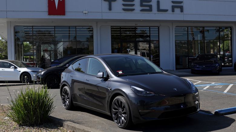 Brand new Tesla cars sit parked at a Tesla dealership on May 31, 2024 in Corte Madera, California.