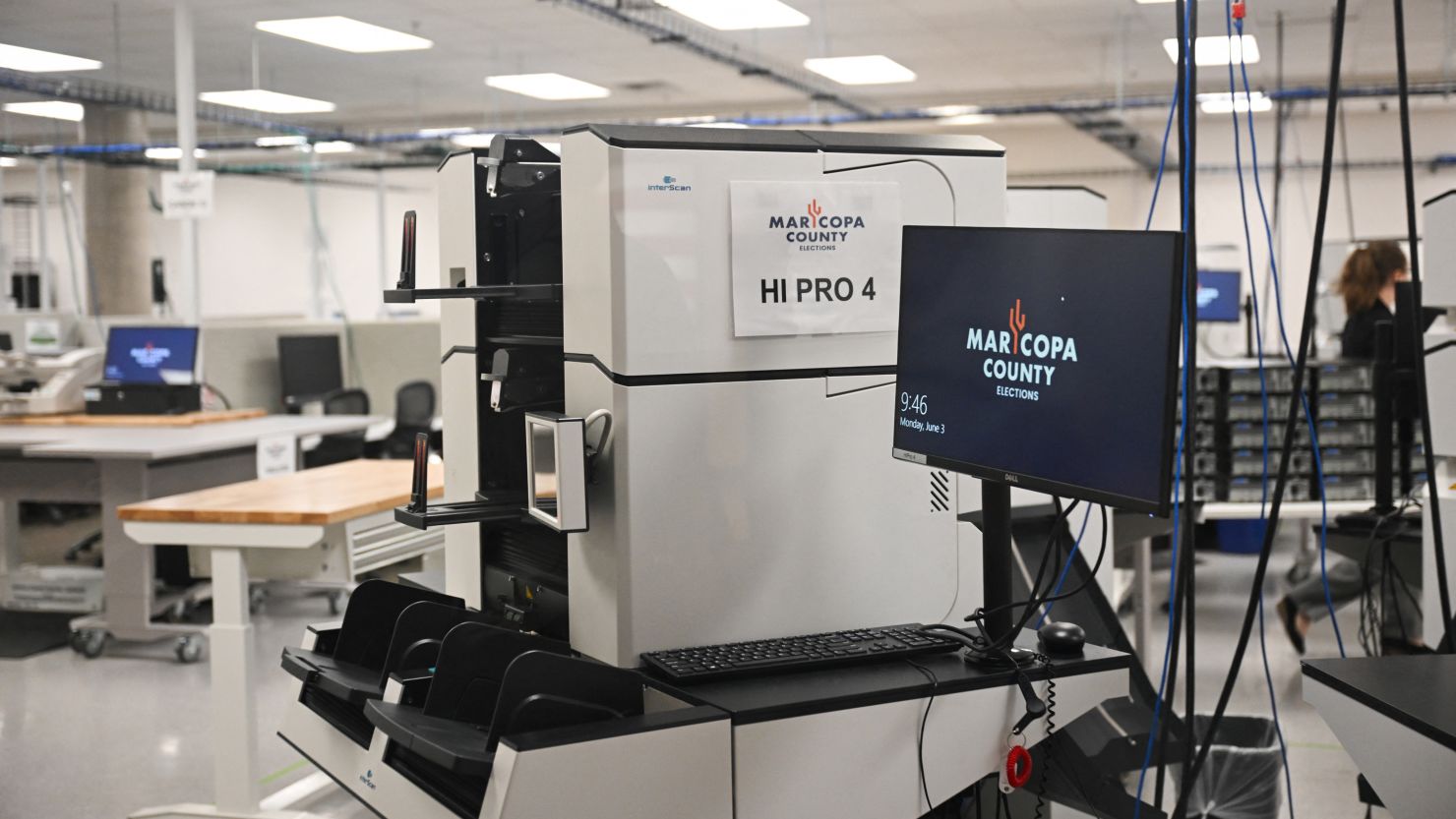 Machines for counting early ballots stand secured in the tabulation room at the Maricopa County Tabulation and Election Center in Phoenix on June 3, 2024.