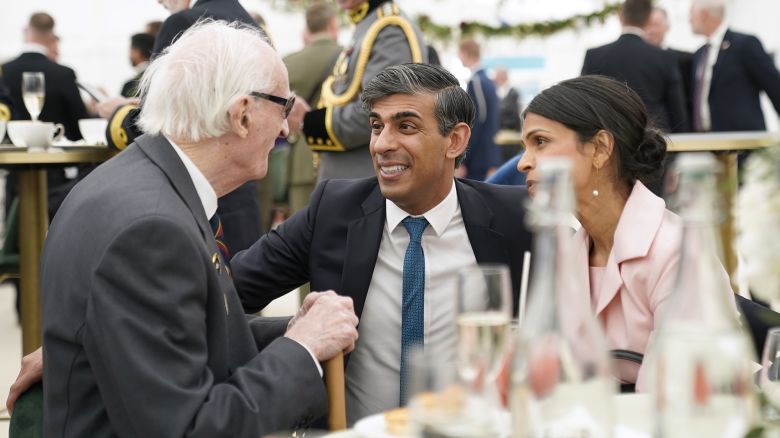 PORTSMOUTH, ENGLAND - JUNE 5: Prime Minister Rishi Sunak and wife Akshata Murty meet veterans during a lunch for veterans and VIPs following the UK's national commemorative event for the 80th anniversary of D-Day, hosted by the Ministry of Defence on Southsea Common on June 5, 2024 in Portsmouth, England. King Charles III and Queen Camilla lead the commemorative events in Portsmouth ahead of the actual 80th Anniversary of D-Day on June 6th. Veterans, VIP Guests and school children are attending an event on Southsea Common. Portsmouth was where tens of thousands of troops set off to Normandy to participate in Operation Overlord. They established a foothold on the French coast and advanced to liberate northwest Europe. (Photo by Andrew Matthews - Pool/Getty Images)