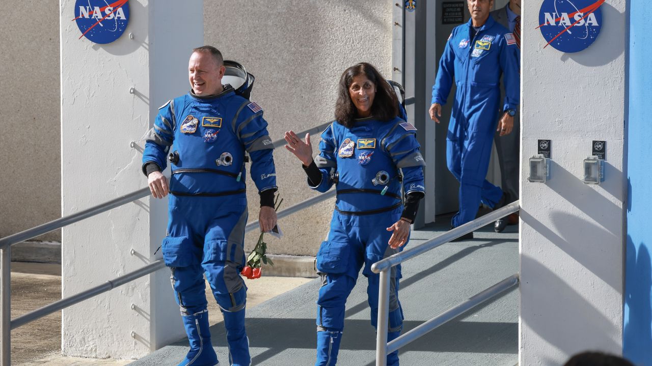 CAPE CANAVERAL, FLORIDA - JUNE 1: Butch Wilmore (left), NASA's Boeing Crew Flight Test commander, and pilot Suni Williams depart the Operations and Checkout Building in Cape Canaveral, Florida, on June 1, 2024. The astronauts are en route to Boeing's Starliner spacecraft, which sits atop a United Launch Alliance Atlas V rocket at Space Launch Complex 41, for NASA's Boeing Crew Flight Test to the International Space Station. (Photo by Joe Raedle/Getty Images)