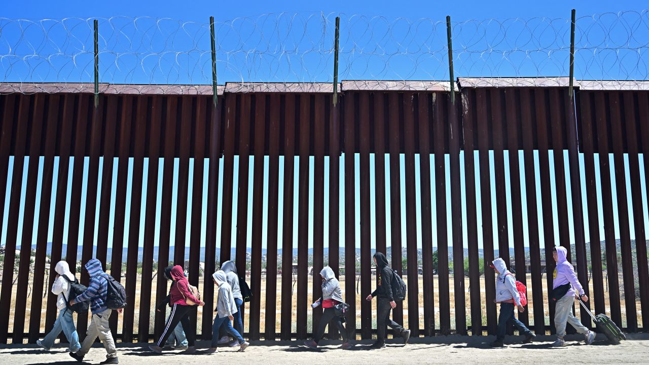 TOPSHOT - Migrants walk on the US side of the border wall in Jacumba Hot Springs, California on June 5, 2024, after crossing from Mexico. Migrants from countries such as Turkey, Jordan, Guatemala, Nicaragua, China and India made their way on foot into the United States today before being met with by Customs and Border Patrol agents for processing. The United States will temporarily close its Mexico border to asylum seekers starting today, June 5, as President Joe Biden as tries to neutralize his political weakness on migration ahead of November's election battle with Donald Trump.
The 81-year-old Democrat signed a long-awaited executive order taking effect at midnight to "gain control" of the southern frontier with Mexico, after record numbers of illegal border crossings sparked concerns among voters. (Photo by Frederic J. BROWN / AFP) (Photo by FREDERIC J. BROWN/AFP via Getty Images)