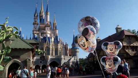 Mickey Mouse and Minnie Mouse ballons fly in front of Cinderella's Castle at the Magic Kingdom Park at Walt Disney World on May 31, 2024, in Orlando, Florida.