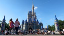 People walk in front of Cinderella's Castle at the Magic Kingdom Park at Walt Disney World on May 31, 2024, in Orlando, Florida.
