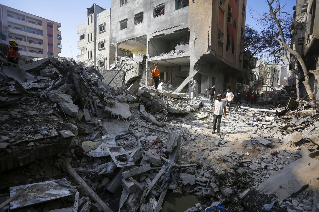 Civil defense teams and locals investigate the rubble after the Israeli operation in Nuseirat camp, Gaza, on June 8, 2024.