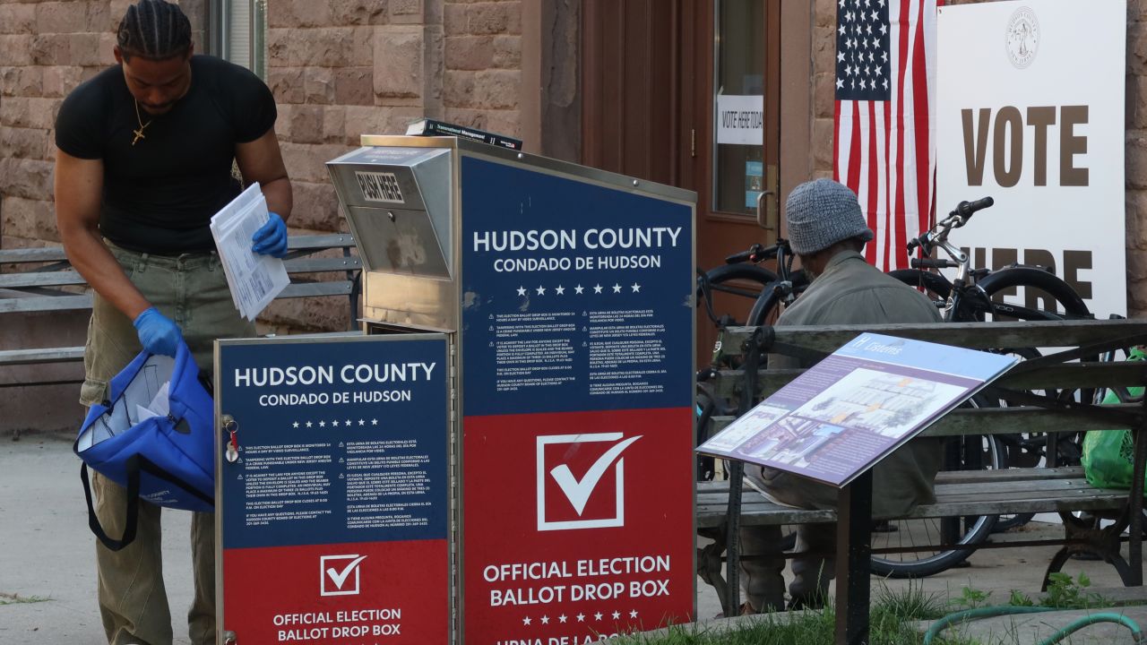 HOBOKEN, NJ - JUNE 4: A  poll worker collects mail in ballots from a drop box for the New Jersey primary election on June 4, 2024, in Hoboken, New Jersey.  (Photo by Gary Hershorn/Getty Images)