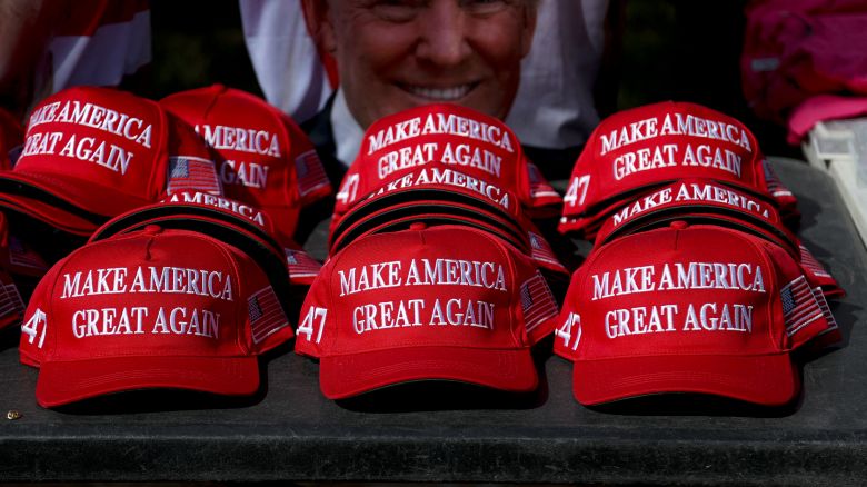 "Make America Great Again" hats sit on a table during a campaign rally for former US President and Republican presidential candidate Donald Trump at Sunset Park in Las Vegas, Nevada on June 9, 2024.
