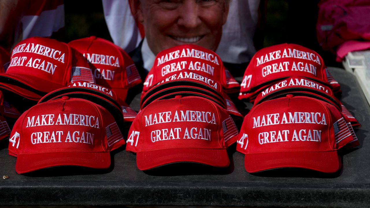 "Make America Great Again" hats sit on a table during a campaign rally for former US President and Republican presidential candidate Donald Trump at Sunset Park in Las Vegas, Nevada on June 9, 2024.