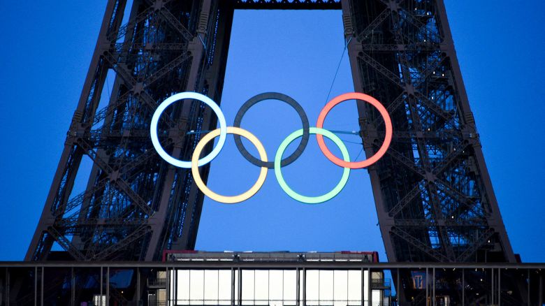 The Olympic rings on the Eiffel Tower in Paris, night time, blue hour, on June 9, 2024, ahead the upcoming Paris 2024 Olympic Games. (Photo by Magali Cohen / Hans Lucas / Hans Lucas via AFP) (Photo by MAGALI COHEN/Hans Lucas/AFP via Getty Images)