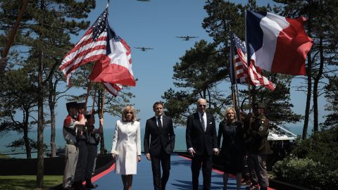 COLLEVILLE-SUR-MER,  - JUNE 06: U.S. President Joe Biden and first lady Jill Biden walk with French President Emmanuel Macron and his wife Brigitte Macron while arriving at a ceremony marking the 80th anniversary of D-Day at the Normandy American Cemetery on June 06, 2024 in Colleville-sur-Mer, . Veterans, families, political leaders and military personnel are gathering in Normandy to commemorate D-Day, which paved the way for the Allied victory over  in World War II. (Photo by Win McNamee/Getty Images)