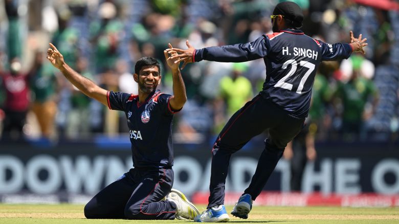 DALLAS, TEXAS - JUNE 06: Saurabh Netravalkar of USA celebrates with teammate Harmeet Singh after USA defeat Pakistan in a super over during the ICC Men's T20 Cricket World Cup West Indies & USA 2024 match between USA and Pakistan at Grand Prairie Cricket Stadium on June 06, 2024 in Dallas, Texas. (Photo by Matt Roberts-ICC/ICC via Getty Images)