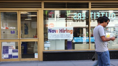 A "Now Hiring" sign is seen at a FedEx location on Broadway on June 07, 2024 in New York City.