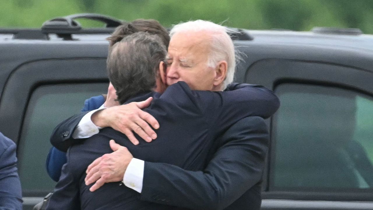 US President Joe Biden hugs his son Hunter Biden upon arrival at Delaware Air National Guard Base in New Castle, Delaware, on June 11, 2024, as he travels to Wilmington, Delaware. A jury found Hunter Biden guilty on June 11 on federal gun charges in a historic first criminal prosecution of the child of a sitting US president. The 54-year-old son of President Joe Biden was convicted on all three of the federal charges facing him, CNN and other US media reported. (Photo by ANDREW CABALLERO-REYNOLDS / AFP) (Photo by ANDREW CABALLERO-REYNOLDS/AFP via Getty Images)